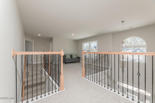 hallway with carpet flooring