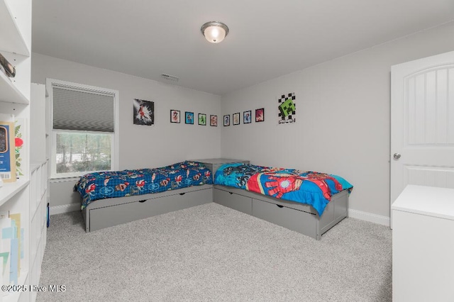 bedroom featuring light colored carpet