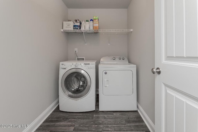 washroom with dark wood-type flooring and independent washer and dryer