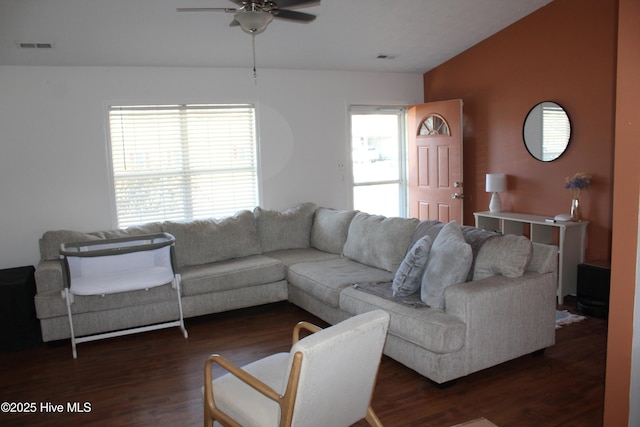 living room with vaulted ceiling, dark wood-type flooring, and ceiling fan