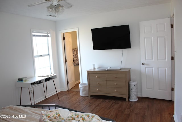 bedroom featuring dark wood-type flooring and ceiling fan