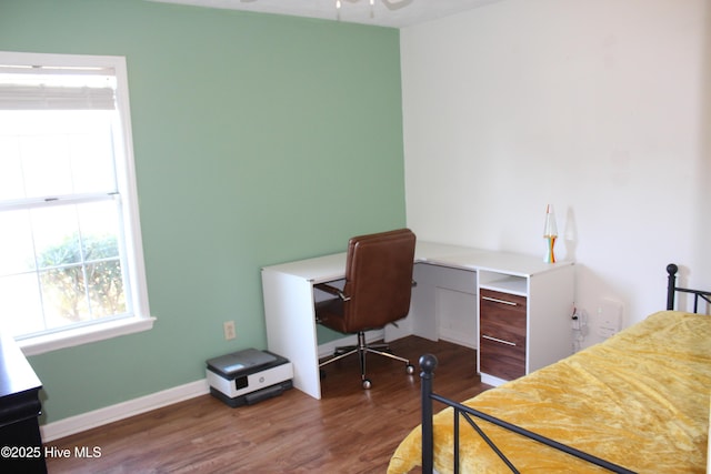 home office featuring ceiling fan and dark hardwood / wood-style flooring