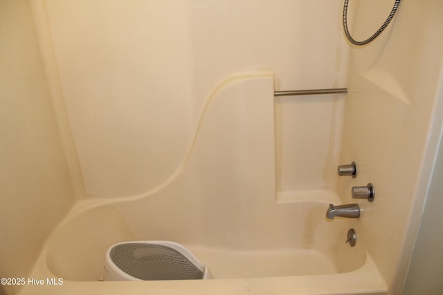 bathroom featuring washtub / shower combination