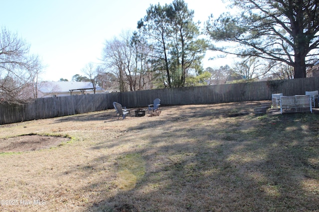 view of yard with an outdoor fire pit