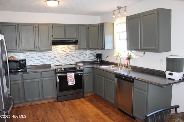 kitchen with appliances with stainless steel finishes and gray cabinetry