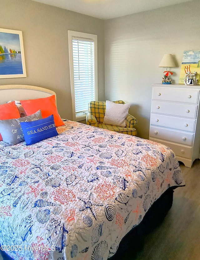 bedroom with hardwood / wood-style flooring