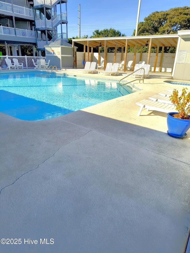 view of swimming pool with a patio