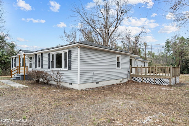 view of property exterior with a wooden deck