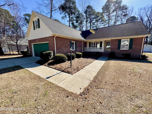 view of front of home featuring a garage and a porch