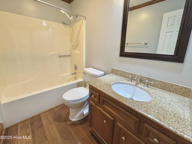 full bathroom featuring vanity, wood-type flooring, bathtub / shower combination, and toilet