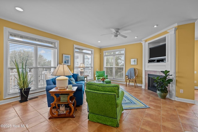 2208 Evans St, Morehead City, NC 28557 - living area featuring ceiling fan, ornamental molding, a tiled fireplace, recessed lighting, and light tile patterned floors