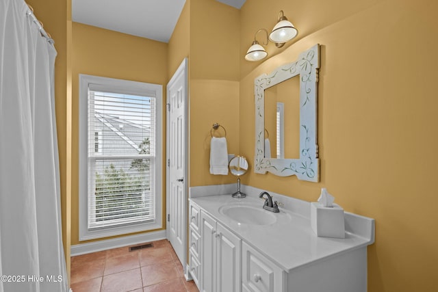 bathroom with vanity and tile patterned floors