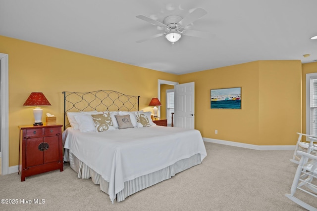 bedroom featuring ceiling fan and carpet