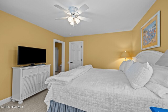 carpeted bedroom featuring ceiling fan