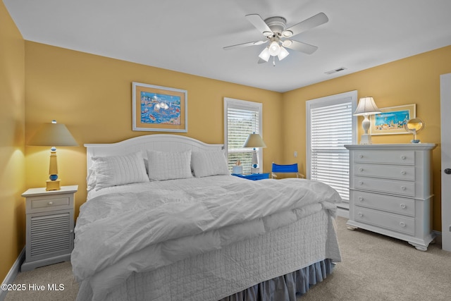 carpeted bedroom with ceiling fan