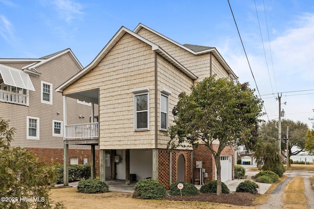 2208 Evans St, Morehead City, NC 28557 - townhome / multi-family property featuring a garage