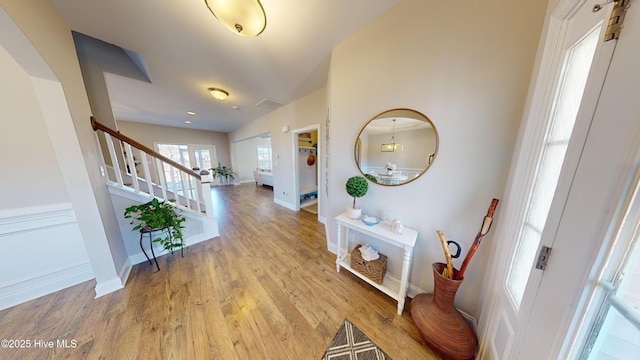 foyer entrance with light wood-type flooring