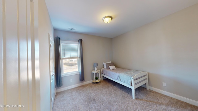 bedroom with light carpet