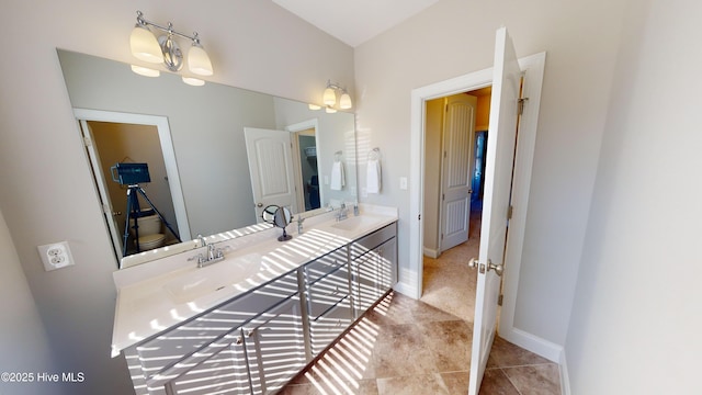 bathroom with tile patterned flooring, vanity, and toilet