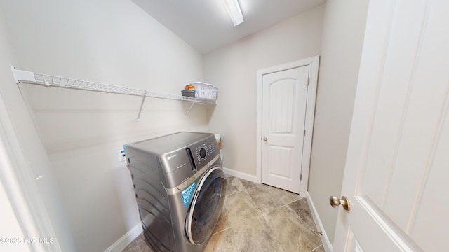 laundry area with washing machine and clothes dryer