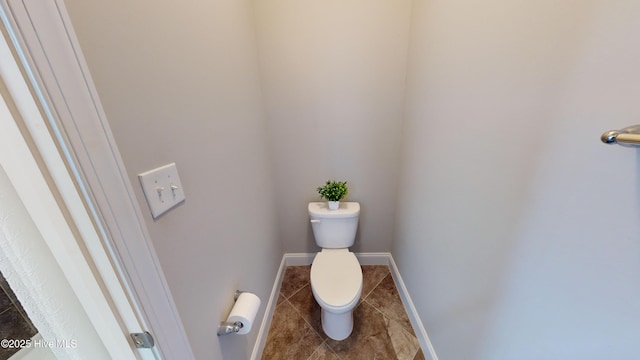 bathroom with tile patterned floors and toilet