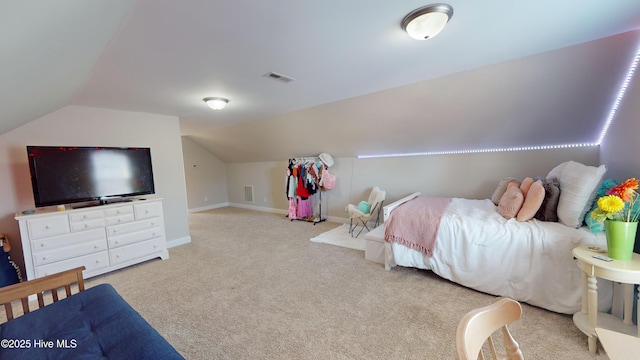 bedroom featuring light colored carpet and lofted ceiling