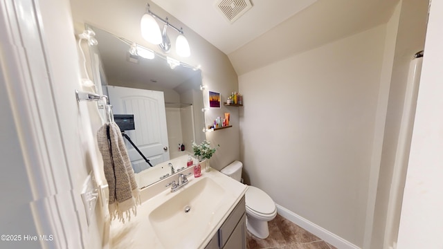 bathroom featuring vanity, tile patterned floors, and toilet