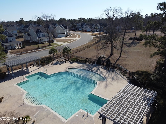 view of swimming pool featuring a pergola and a patio area