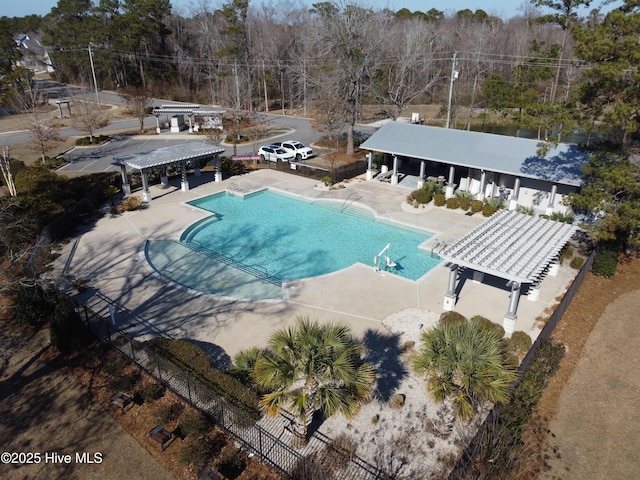 view of swimming pool featuring a pergola and a patio