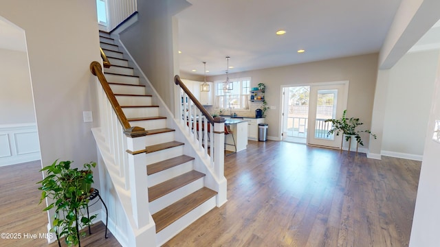 staircase featuring hardwood / wood-style flooring