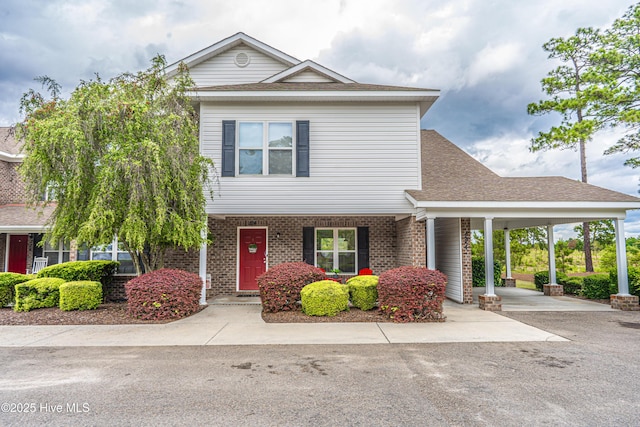 view of front of home with a carport