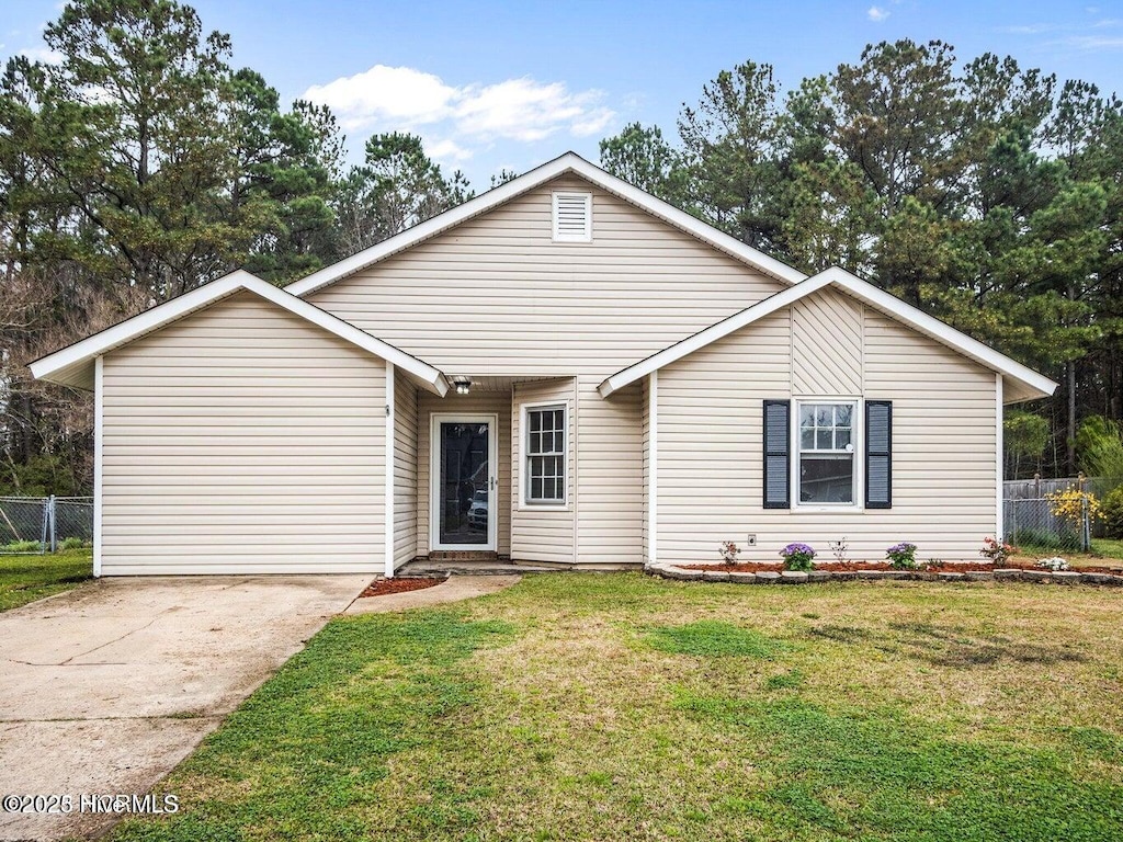 ranch-style home featuring a front yard