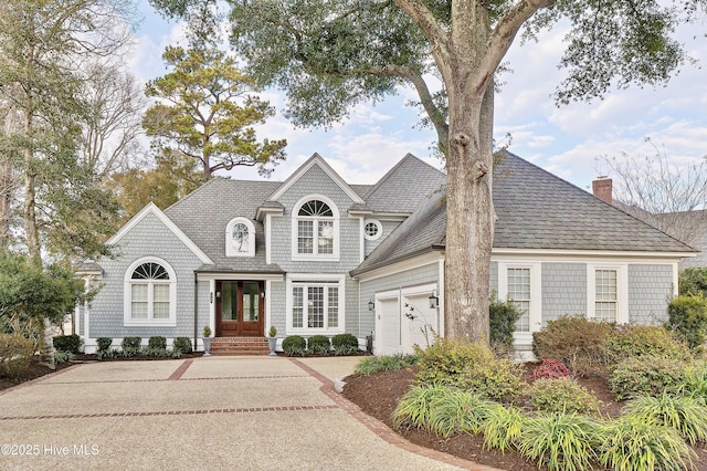 view of front facade with french doors and a garage