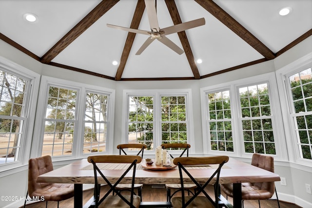 sunroom featuring ceiling fan and lofted ceiling with beams