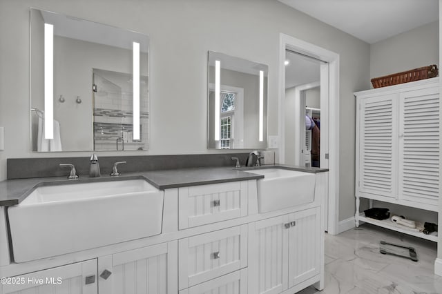 bathroom featuring vanity and a shower with shower door