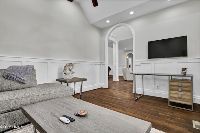 living room with vaulted ceiling, dark wood-type flooring, and ceiling fan