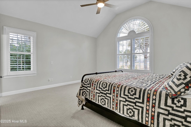 carpeted bedroom with vaulted ceiling and ceiling fan