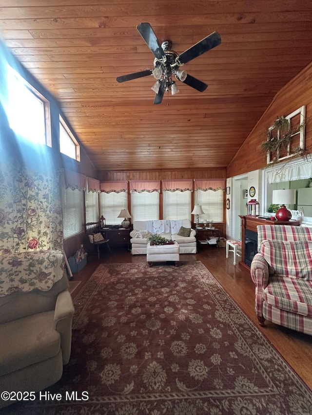 living room featuring wood ceiling, ceiling fan, lofted ceiling, and dark wood-type flooring