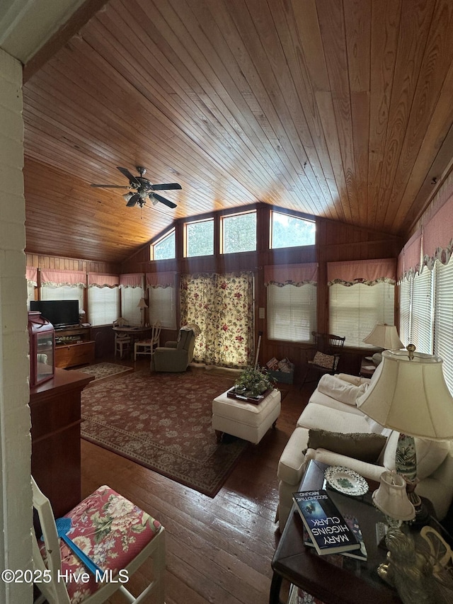 interior space featuring ceiling fan, lofted ceiling, and wooden ceiling