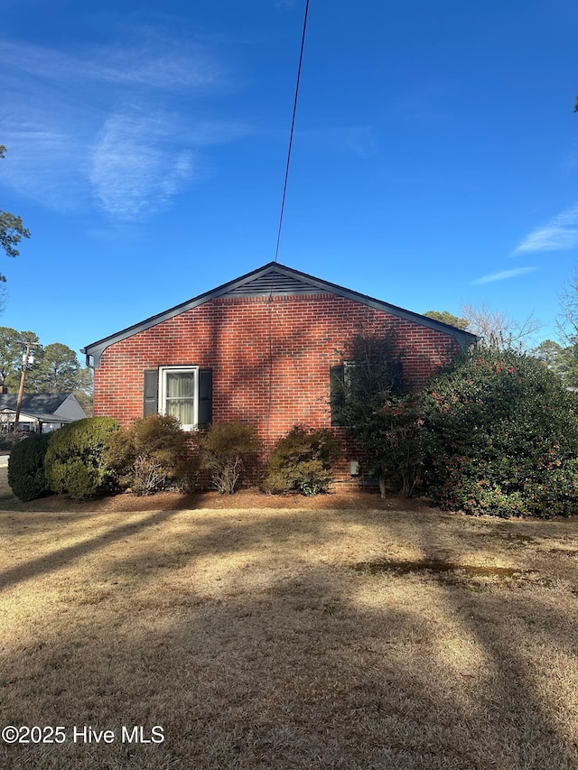 view of home's exterior featuring a yard