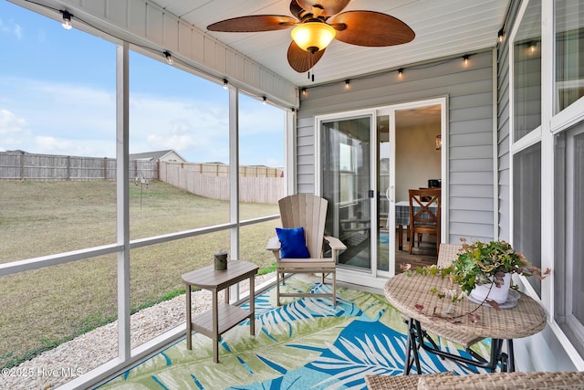 sunroom / solarium with ceiling fan