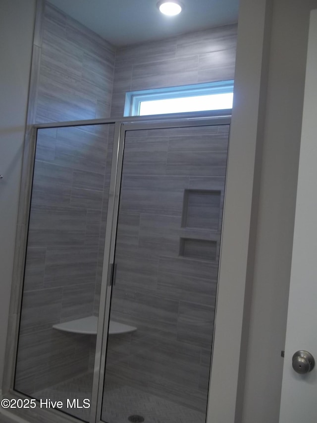 full bathroom featuring a stall shower