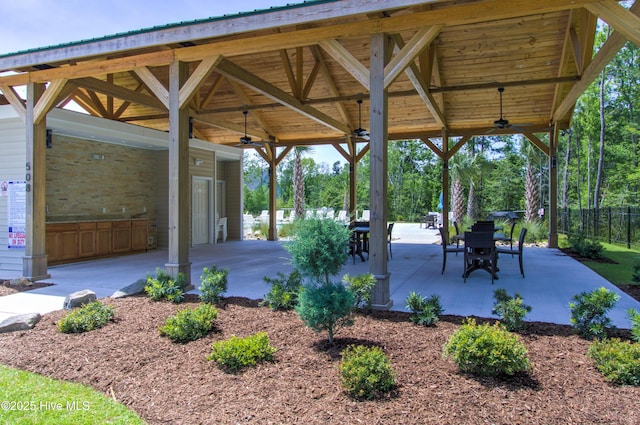 view of home's community featuring a carport, a patio, and fence