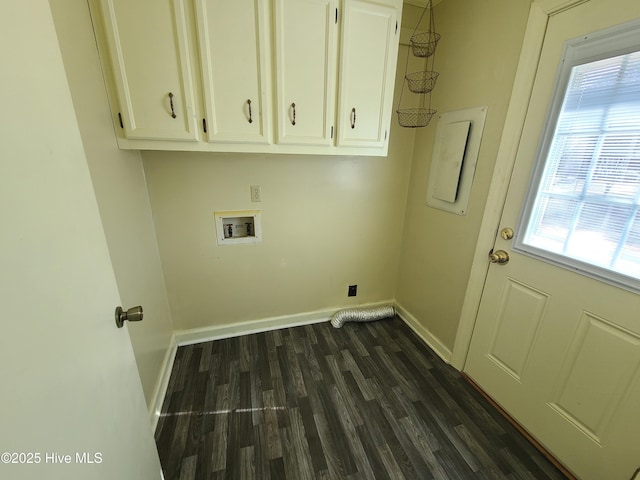 clothes washing area with cabinets, dark hardwood / wood-style floors, and washer hookup