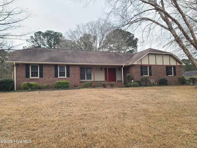 ranch-style home featuring a front yard