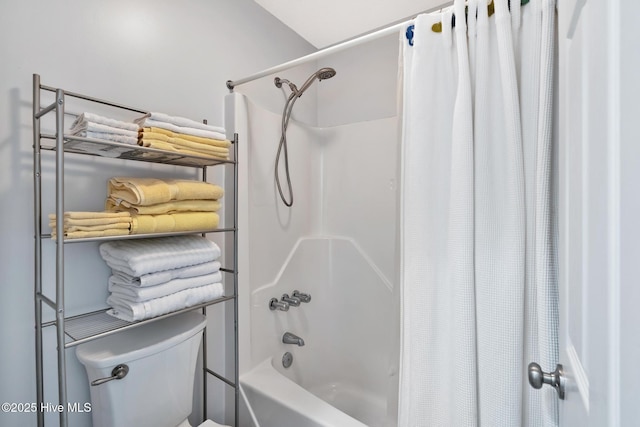 bathroom with shower / tub combo and toilet