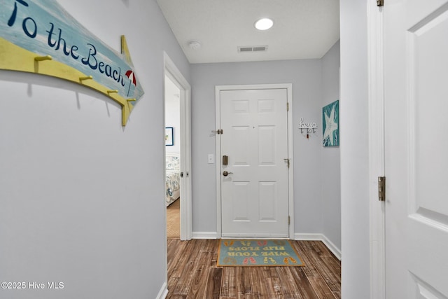 entryway with wood-type flooring