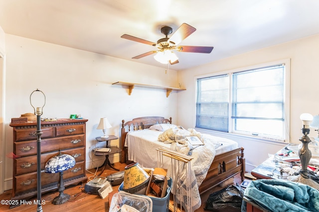 bedroom featuring hardwood / wood-style floors and ceiling fan