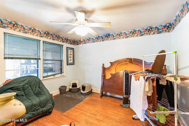 bedroom with ceiling fan and hardwood / wood-style floors
