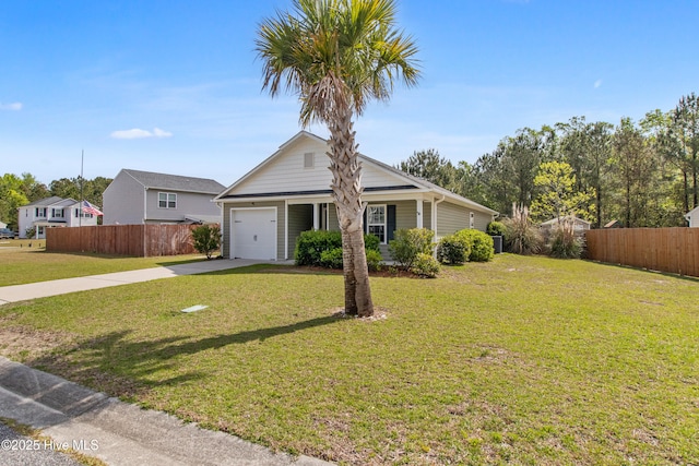 single story home featuring driveway, a garage, fence, and a front yard